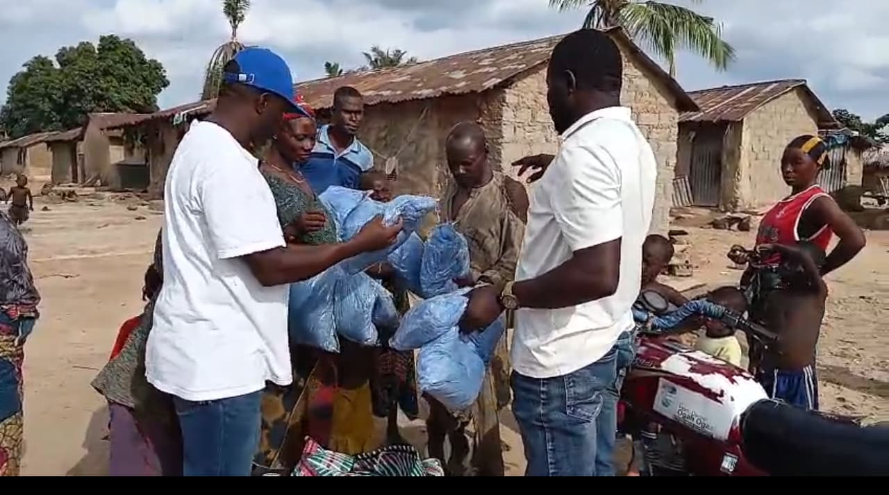 Haruna  Sylvester distributing bed nets